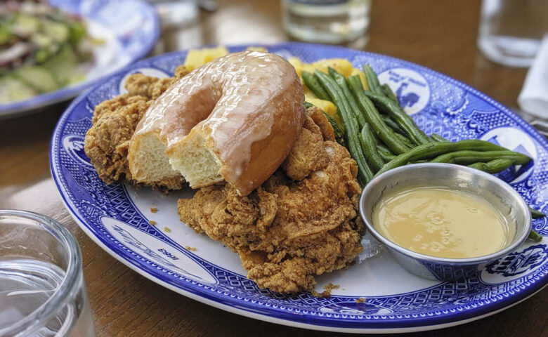 donut and fried chickenon a blue plate