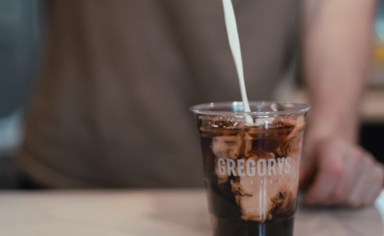 cream being poured into coffee