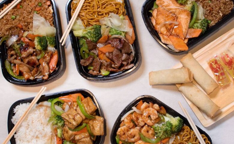 aerial view of chinese food in takeout containers